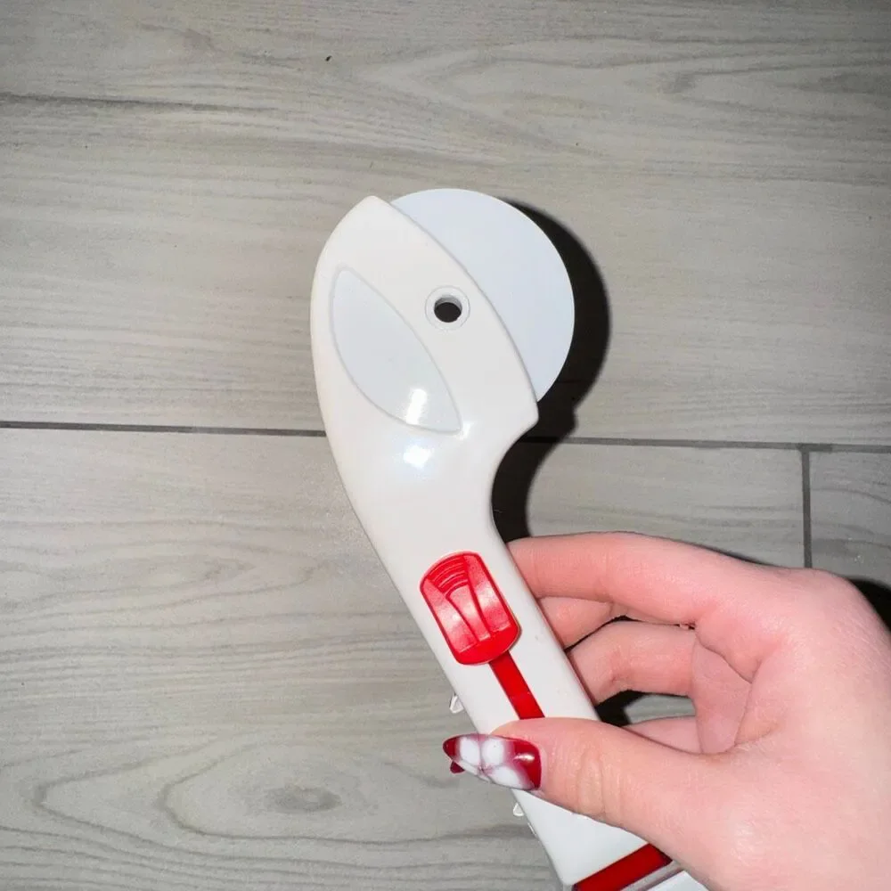 Vintage pizza cutter, cake cutter. Has a switch to push slice off and can be tak